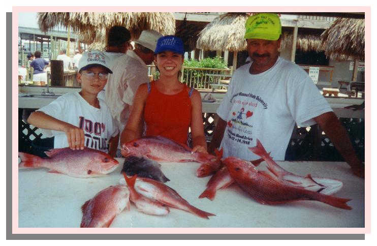 Lucas, Dad, and I after deep sea fishing with the red snappers we caught.